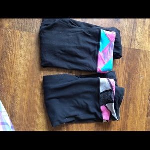 two pairs of kids lululemon brand leggings